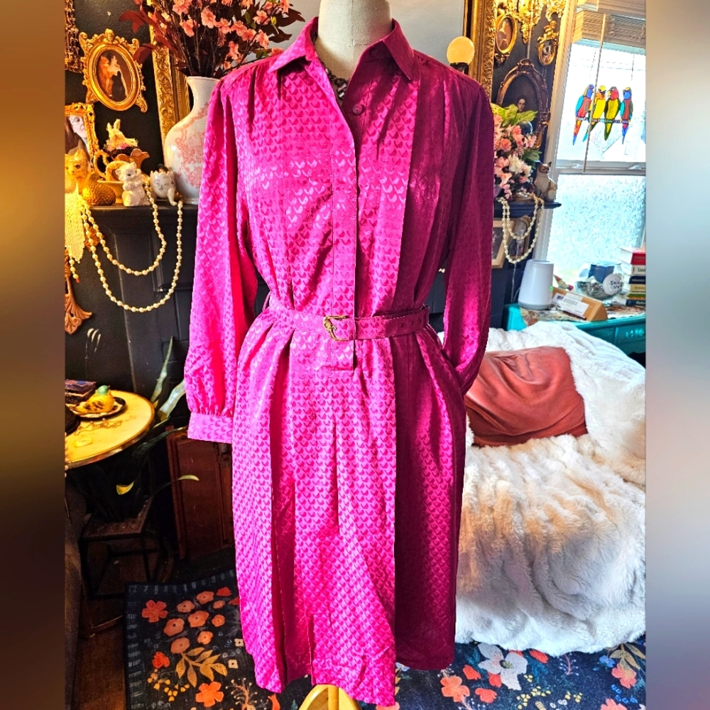 Vintage fuchsia long-sleeved button-up maxi dress with belt.